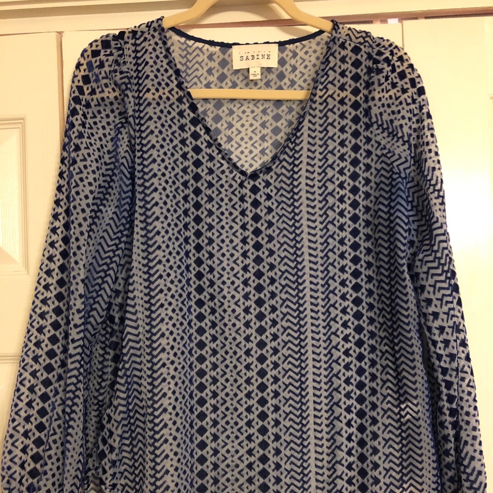 Blue opaque long sleeved patterned blouse